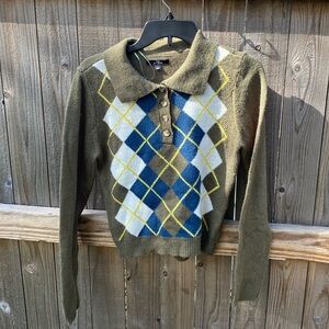 Green sweater, says Large but fits like a medium